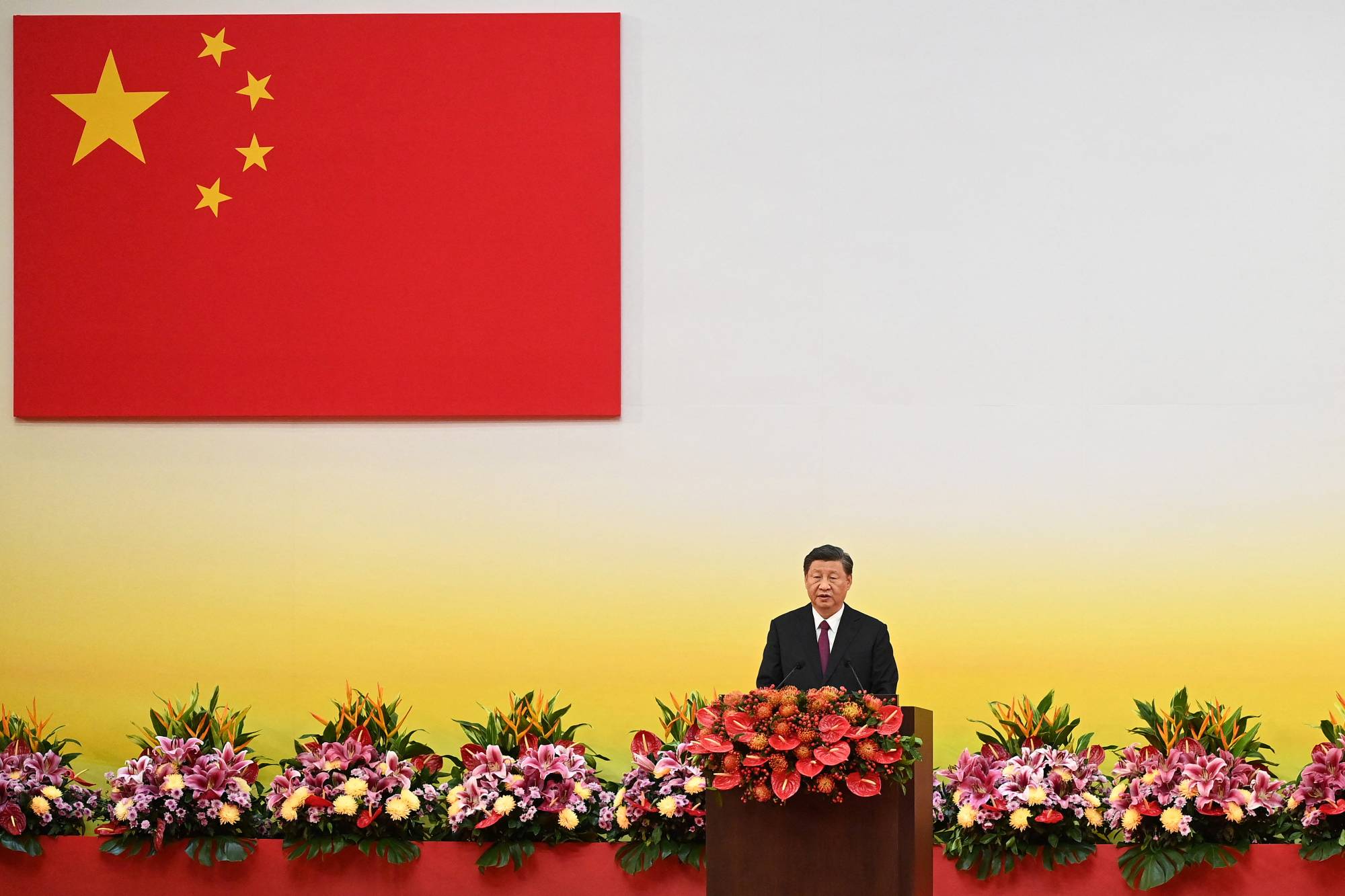 Chinese President Xi Jinping gives a speech at the swearing-in ceremony of Hong Kong's new leader and government in the city on July 1 — the 25th anniversary of Hong Kong's handover from Britain.  | POOL / VIA REUTERS
