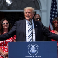 Former U.S. President Donald Trump speaks to representatives of the media at his golf club in Bedminster, New Jersey, in July 2021. | REUTERS