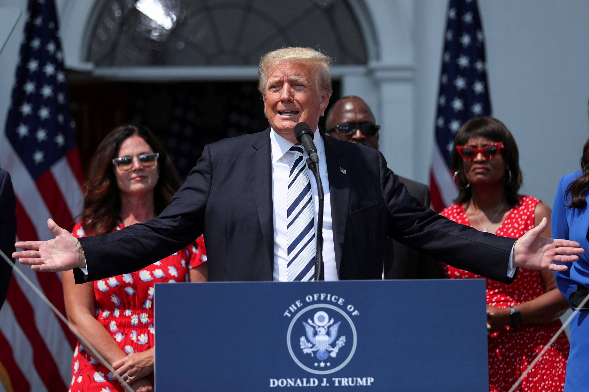 Former U.S. President Donald Trump speaks to representatives of the media at his golf club in Bedminster, New Jersey, in July 2021. | REUTERS