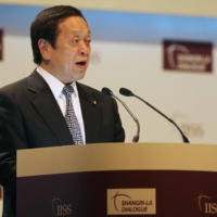Yasukazu Hamada, Japan\'s defense chief at the time, speaks during the Shangri-La Dialogue security conference in Singapore in May 2009. | REUTERS