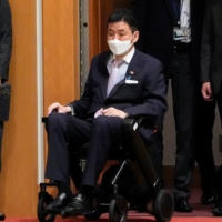 Defense Minister Nobuo Kishi arrives for a ceremony prior to a Japan-Australia bilateral defense meeting at the Defense Ministry in Tokyo on June 15. | POOL / VIA REUTERS