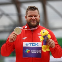 Poland\'s Pawel Fajdek celebrates after winning the men\'s hammer throw at the World Athletics Championships in Eugene, Oregon, on July 16. | REUTERS