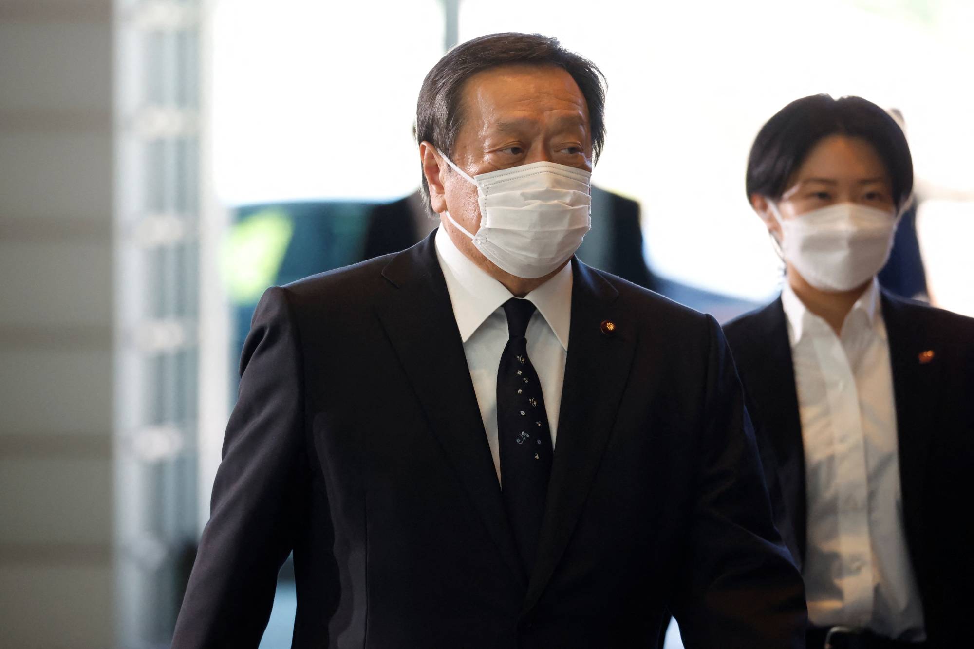 Yasukazu Hamada, appointed as defense minister, arrives at the Prime Minister's Office on Wednesday. | Reuters