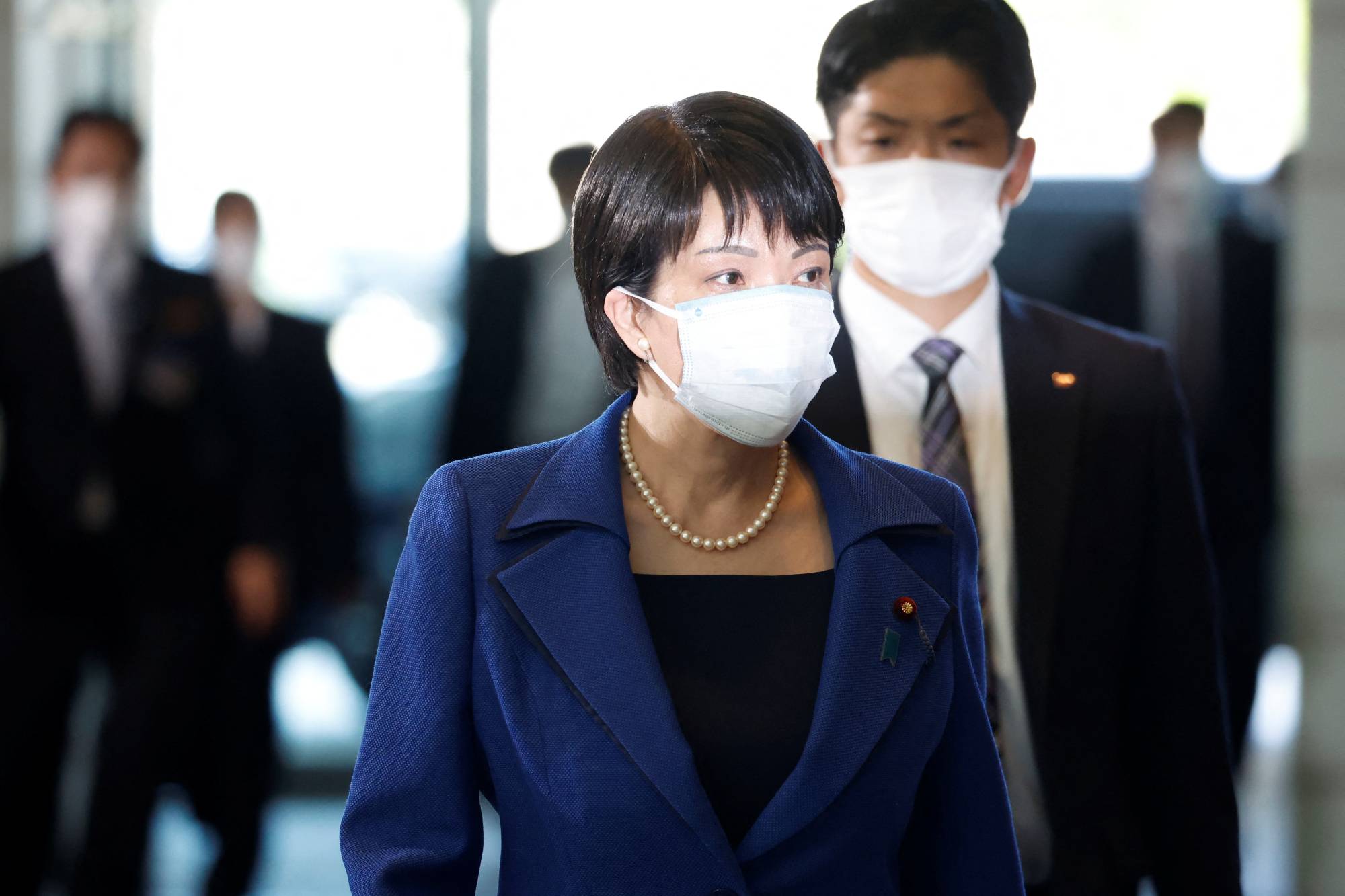 Sanae Takaichi, appointed as the minister in charge of economic security, arrives at the Prime Minister's Office Wednesday. | Reuters
