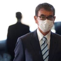 Taro Kono, appointed as the minister for digital transformation, arrives at the Prime Minister\'s Office on Wednesday. | REUTERS