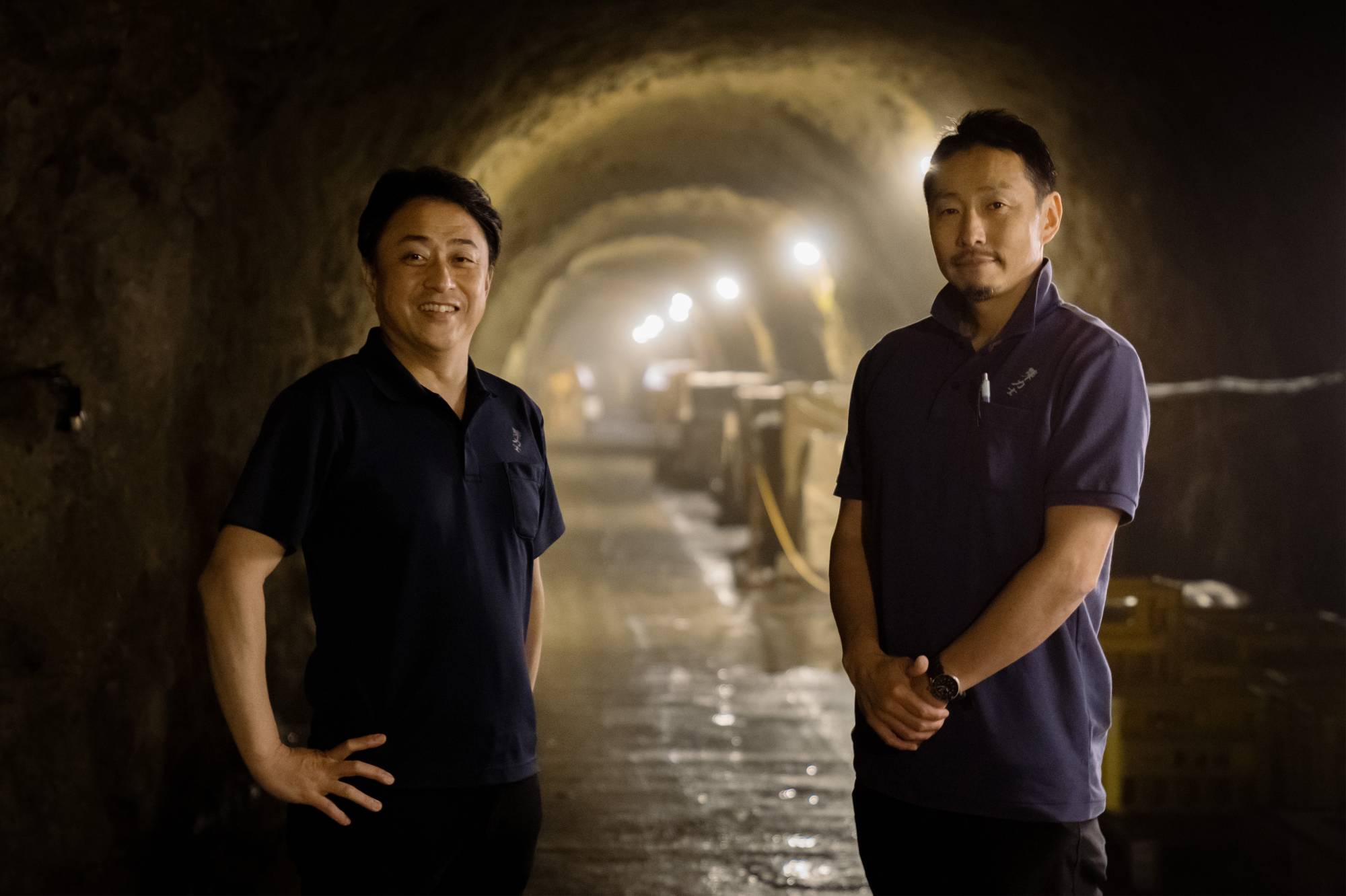 Shimazaki Brewery president Kenichi Shimazaki (left) and cave manager Tetsuya Kasai claim their unique aging techniques produce superior sips of Japan's essential drink. | COURTESY OF CINDY BISSIG