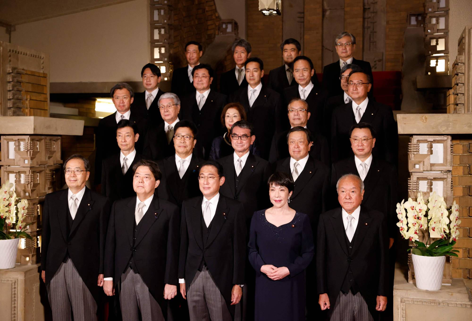 Prime Minister Fumio Kishida and his Cabinet ministers pose for a photo session at his official residence in Tokyo on Wednesday. | POOL / VIA AFP-JIJI