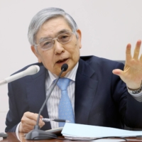 Bank of Japan Gov. Haruhiko Kuroda\'s ultra-loose monetary policy is likely to stay intact following a Cabinet reshuffle Wednesday. | JIJI / VIA BLOOMBERG