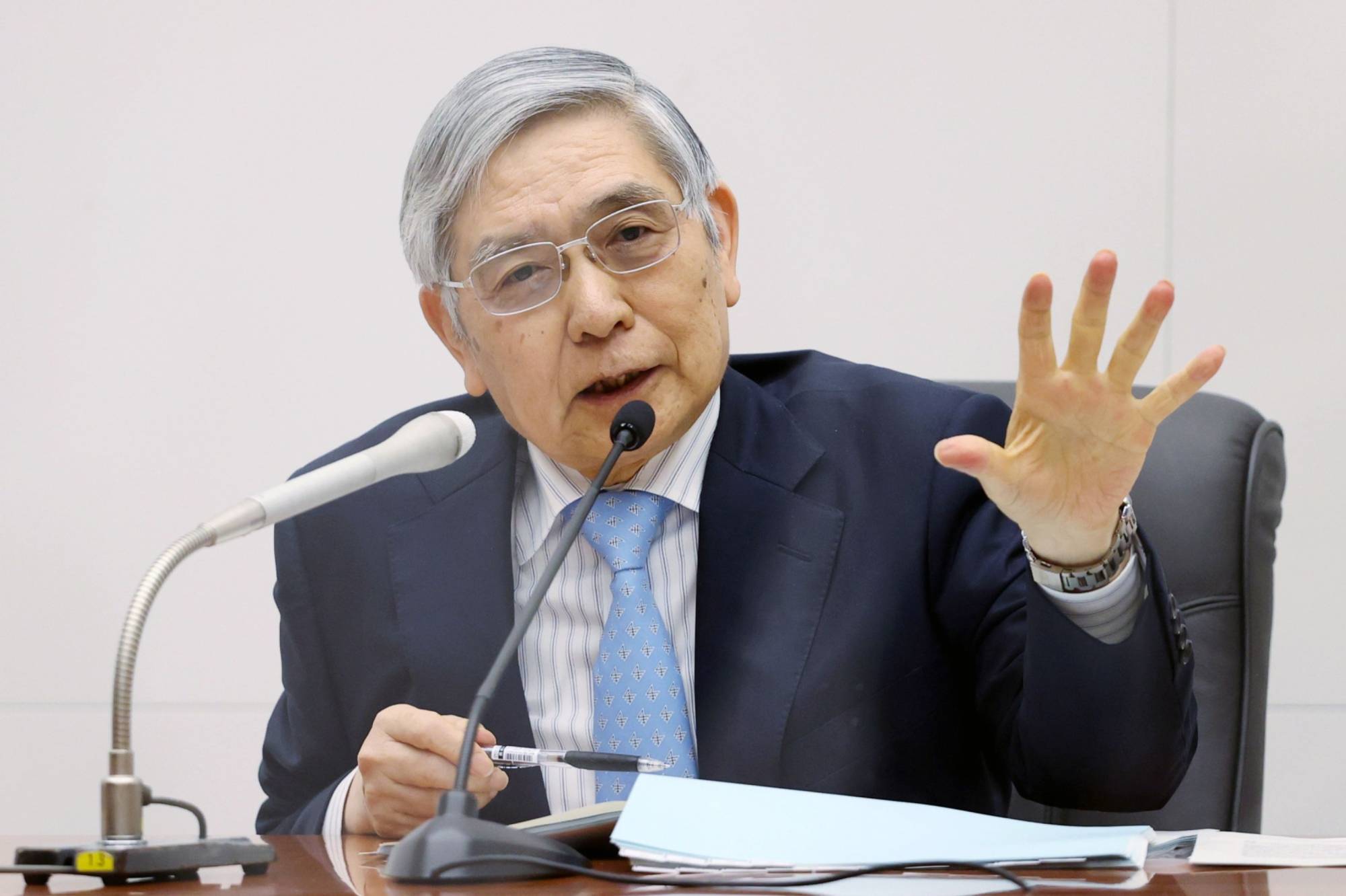Bank of Japan Gov. Haruhiko Kuroda's ultra-loose monetary policy is likely to stay intact following a Cabinet reshuffle Wednesday. | Jiji / via Bloomberg