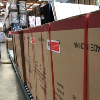 Boxes marked \'Made in China\' line floors of warehouse in Cypress, California, in 2019. The tariffs were imposed in 2018 and 2019 by Trump on thousands of Chinese imports valued then at $370 billion to pressure China over its suspected theft of U.S. intellectual property. | REUTERS