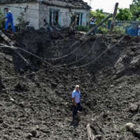 A crater left by a Russian missile strike in the settlement of Kushuhum, in the Zaporizhzhia region of Ukraine, on Wednesday | REUTERS