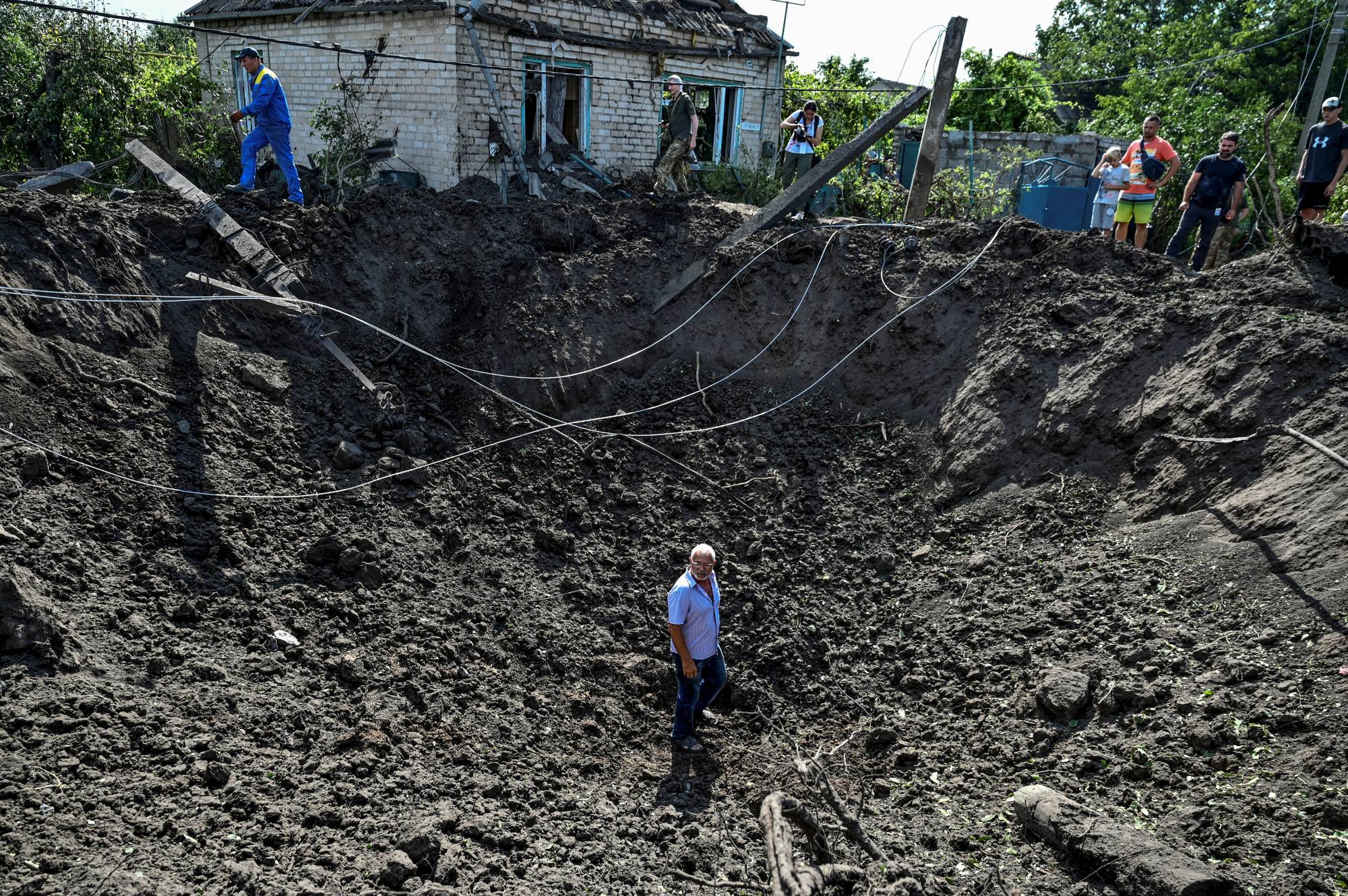 A crater left by a Russian missile strike in the settlement of Kushuhum, in the Zaporizhzhia region of Ukraine, on Wednesday | REUTERS