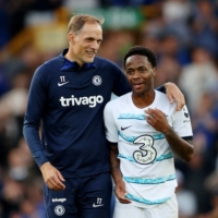Chelsea\'s Raheem Sterling celebrates with manager Thomas Tuchel after the team\'s season-opening win over Everton in Liverpool on Sunday. | REUTERS