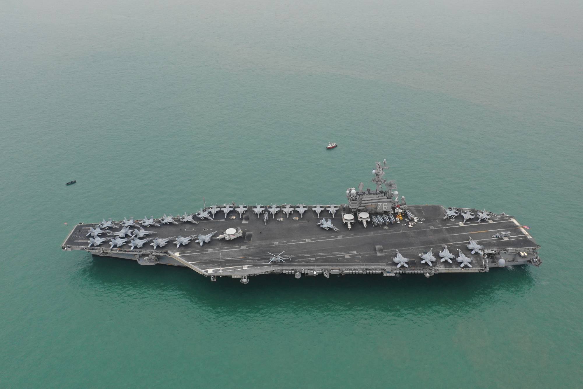 The USS Ronald Reagan aircraft carrier leaves Victoria Harbor after a visit to Hong Kong in November 2018. | Caixin Media / via REUTERS 