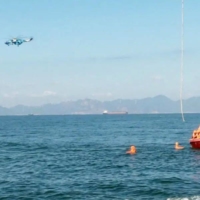 A helicopter and boat under the Eastern Theater Command of China\'s People\'s Liberation Army  take part in a maritime rescue drill as part of military exercises near Taiwan on Tuesday.  | EASTERN THEATER COMMAND / VIA REUTERS 