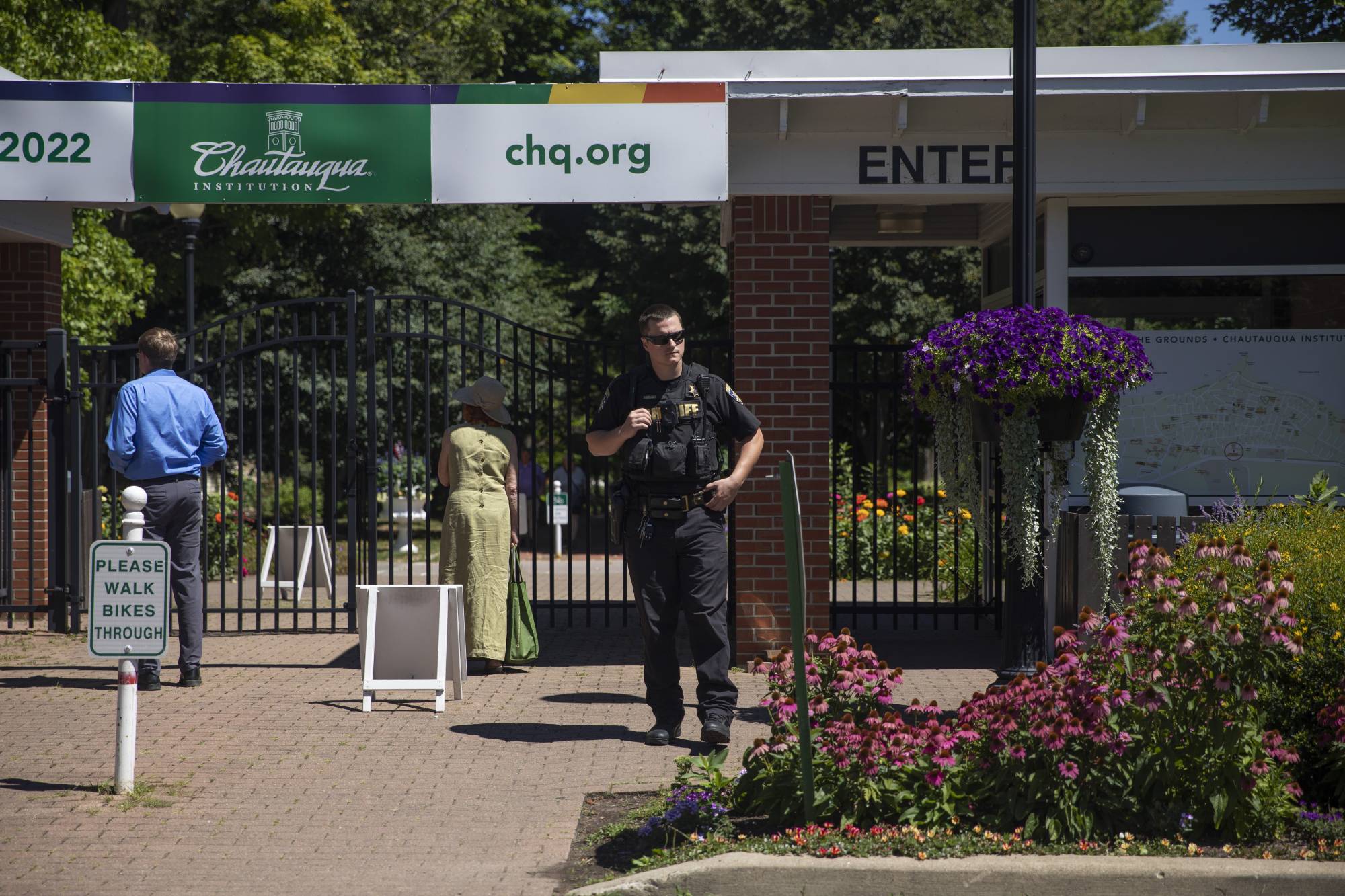 Police gather outside of the Chautauqua Institute in New York state, where author Salman Rushdie was attacked on Friday.  | MADDIE MCGARVEY / THE NEW YORK TIMES