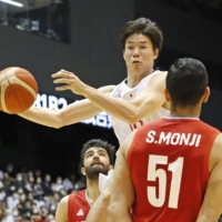 Japan\'s Yudai Baba attacks the Iranian net during the first quarter in Sendai on Saturday. | KYODO