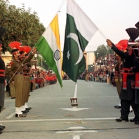 Pakistani border guards (right) and their Indian counterparts take part in the daily closing ceremony of the Wagah border crossing near Lahore, the provincial capital
of Punjab, Pakistan.

  |  REUTERS