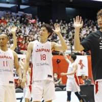 Akatsuki Japan players wave to fans after sweeping their friendly series with Iran in Sendai on Sunday. | KYODO