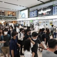 The departure lobby for domestic flights is crowded with travelers at Fukuoka airport on Sunday as many people return to Tokyo after spending their holidays in their hometowns. | KYODO