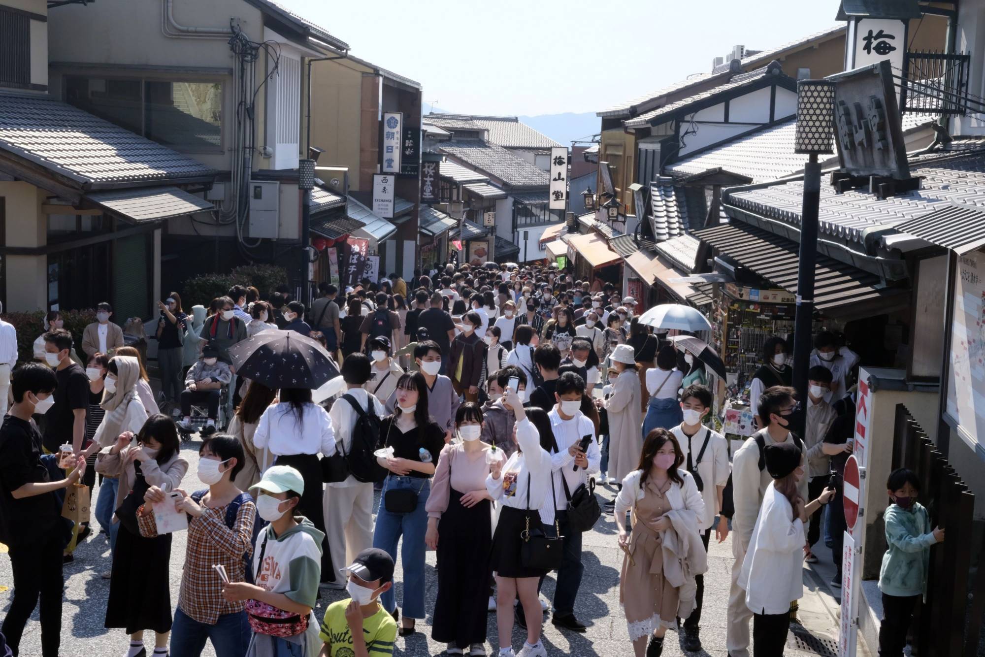 An approach to Kiyomizu temple is packed with tourists during Japan's Golden Week holidays in Kyoto in May. | BLOOMBERG
