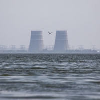 The Zaporizhzhia nuclear complex, along the banks of the Dnipro River, in Zaporizhzhia, Ukraine, on Saturday. Shelling near a nuclear power complex in southern Ukraine killed a foreman from the facility at his home in a neighboring town. |  DAVID GUTTENFELDER / THE NEW YORK TIMES