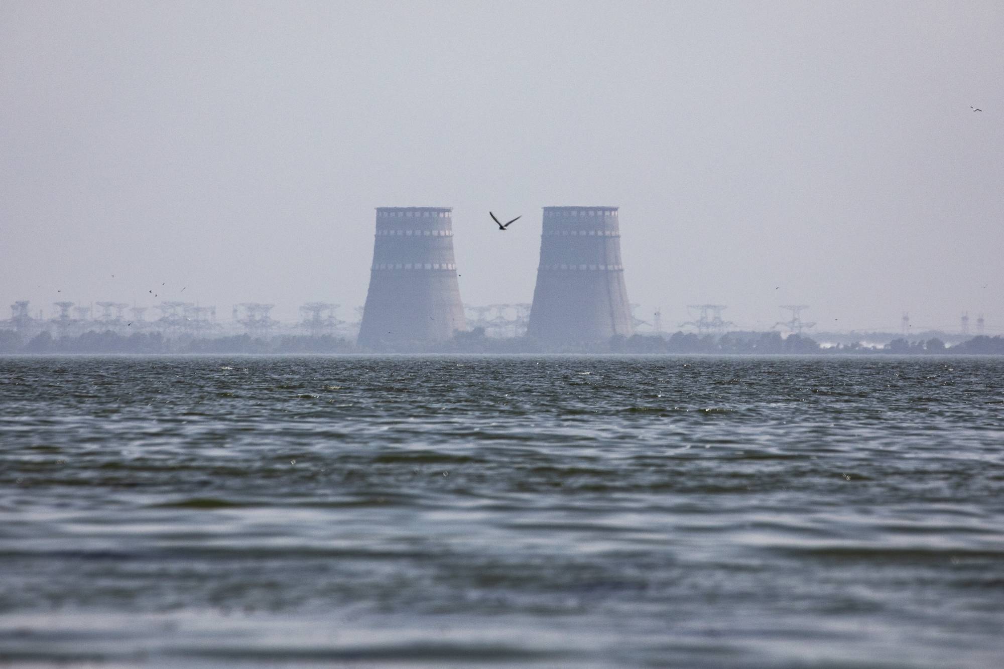The Zaporizhzhia nuclear complex, along the banks of the Dnipro River, in Zaporizhzhia, Ukraine, on Saturday. Shelling near a nuclear power complex in southern Ukraine killed a foreman from the facility at his home in a neighboring town. | David Guttenfelder / The New York Times