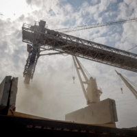 The Brave Commander, a U.N.-chartered vessel, loads more than 23,000 tonnes of grain for export to Ethiopia, in Yuzhne, Ukraine, on Sunday. | AFP-JIJI