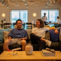 José Paz Rendal (right), head of cargo.one’s expansion efforts, sits with the company’s sole local hire to date, Yoichi Mizuno. Paz Rendal says the hope is to hire five more locals before the year is out. Hiring Japanese staff is a must for any company that wants to do business in the country. | AFP-JIJI