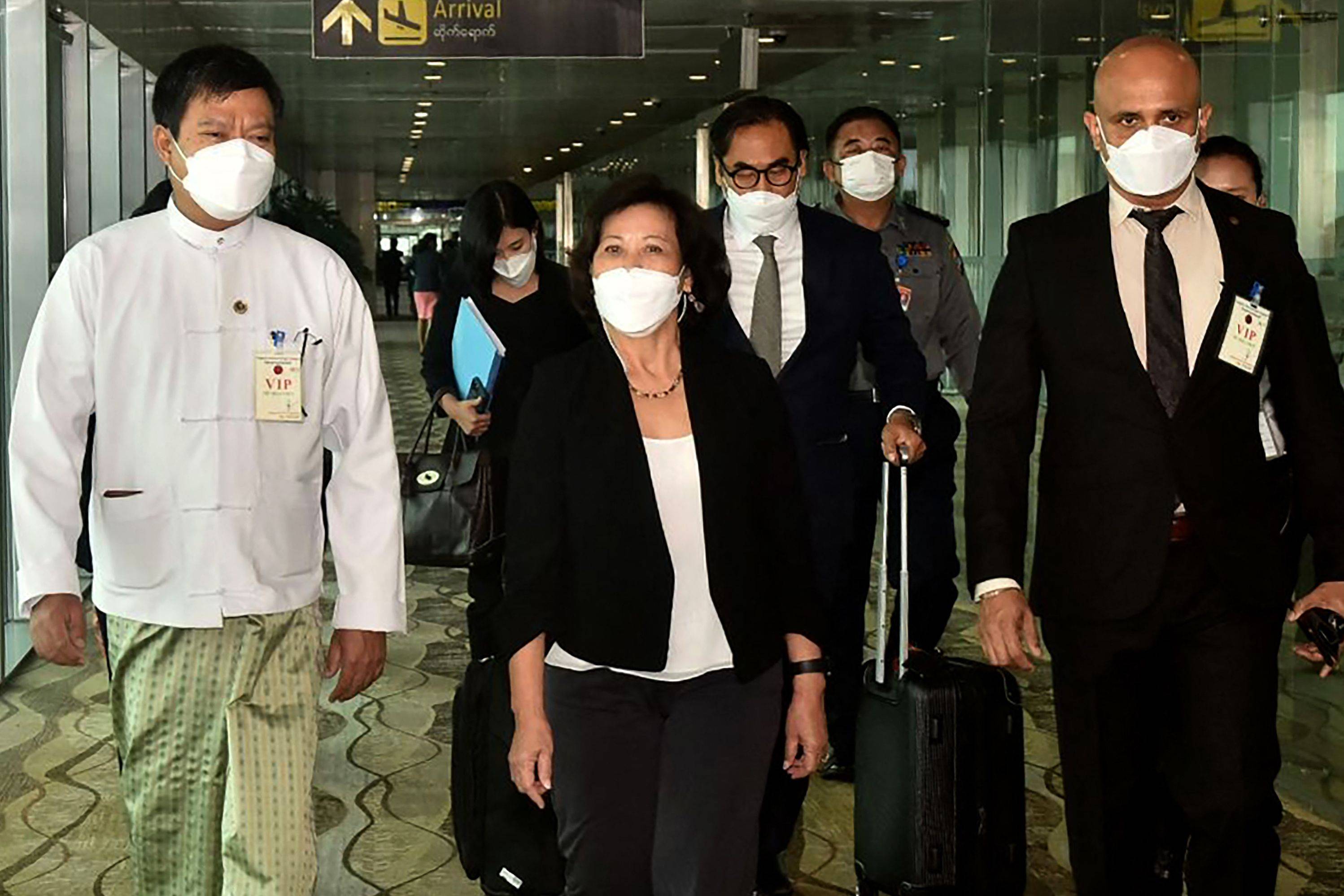 United Nations Special Envoy on Myanmar Noeleen Heyzer (center) walking with high-level officials following her arrival at the airport in Yangon, Myanmar, on Tuesday. | MYANMAR'S MILITARY INFORMATION TEAM / VIA AFP-JIJI