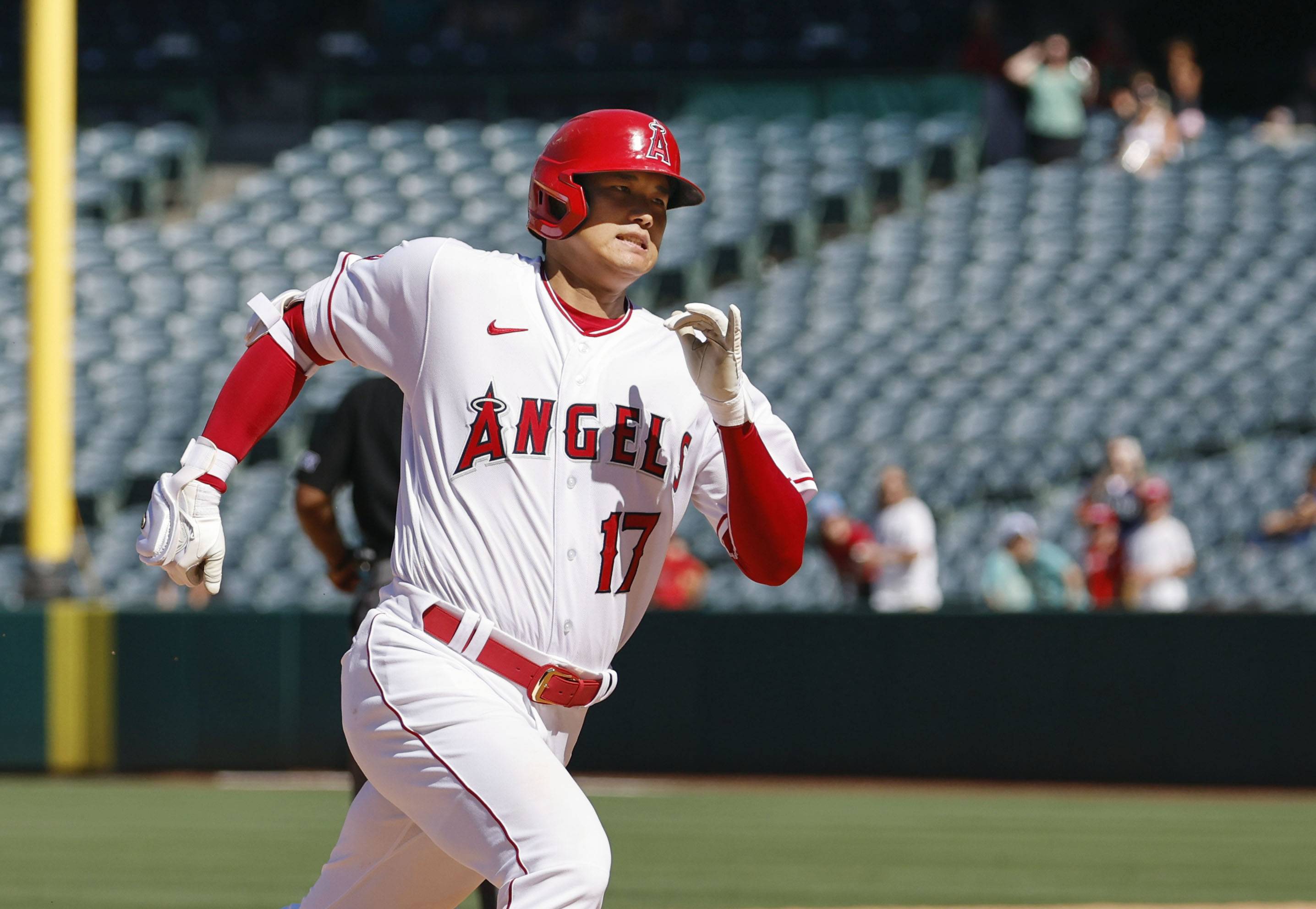 Shohei Ohtani hits an RBI triple against the Mariners during the seventh inning in Anaheim, California, on Wednesday. | KYODO