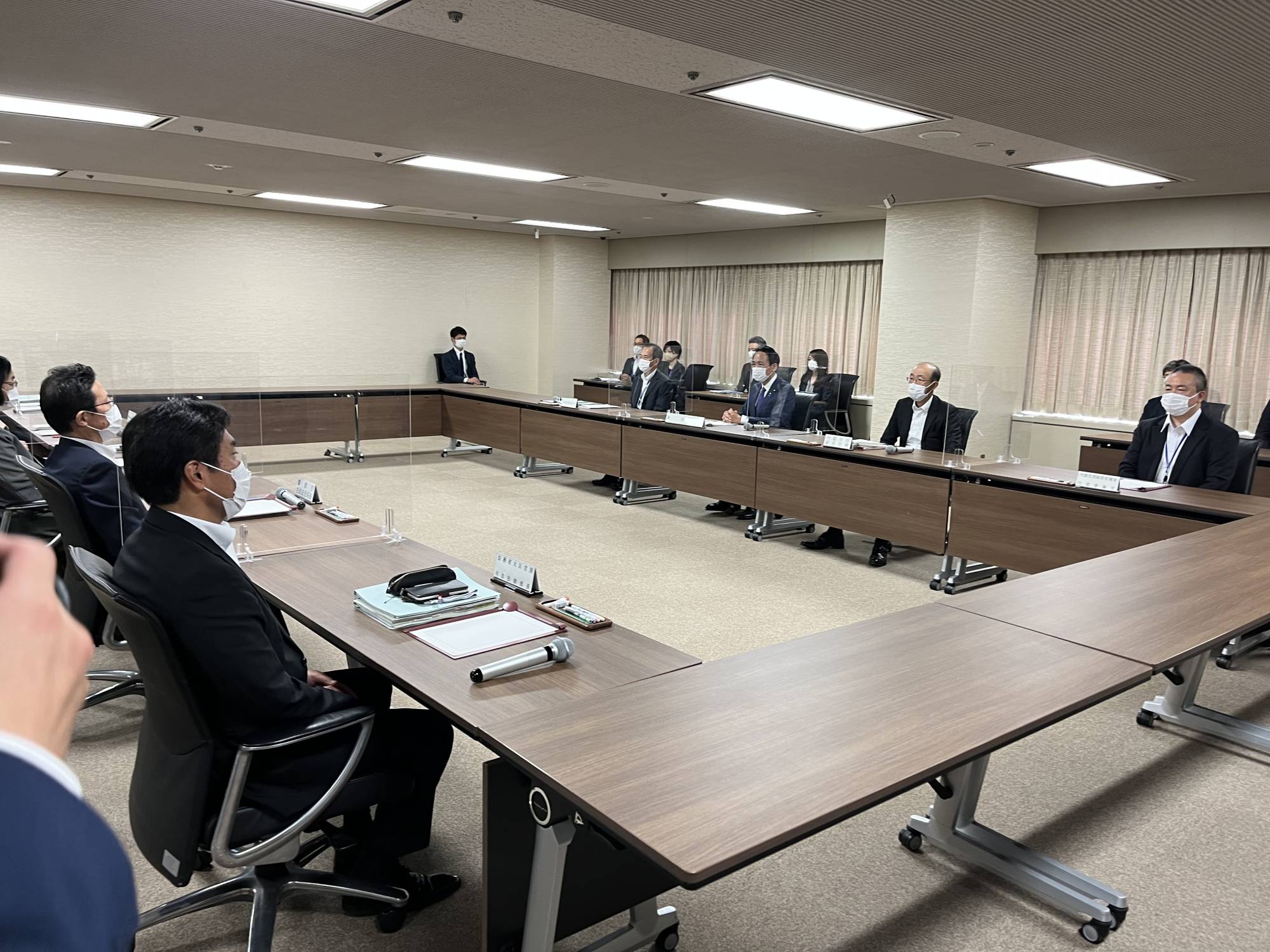 Justice Minister Yasuhiro Hanashi (back center) and senior officials from various ministries hold a meeting on Thursday in Tokyo to discuss steps to support victims of the Unification Church. | KANAKO TAKAHARA
