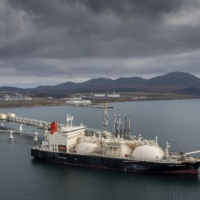 A tanker loads LNG from Russia\'s Sakhalin-2 project in October 2021. | AP / VIA KYODO