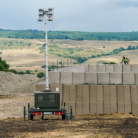 Soldiers from the NATO Battle Group Forward Presence work on the base construction site at the Getica National Joint Training Center in Cincu, Romania, on Aug. 1. | BLOOMBERG