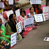 Activists hold placards during a protest in New Delhi on Thursday against the release of men convicted of gang-raping Bilkis Bano in 2002.  | AFP-JIJI