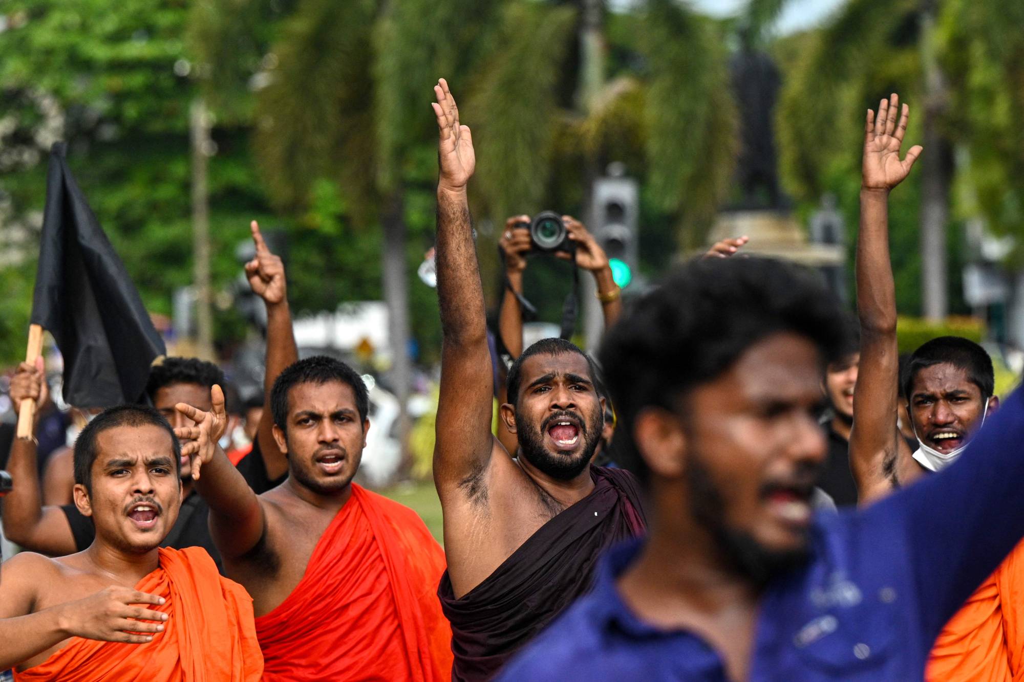 Sri Lankans take part in a demonstration in Colombo on Thursday.  | AFP-JIJI
