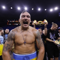  Oleksandr Usyk celebrates after winning his fight against Anthony Joshua in Jeddah on Saturday. | REUTERS