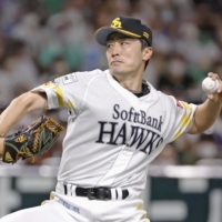 SoftBank\'s Tsuyoshi Wada pitches against the Fighters in Fukuoka on Sunday. | KYODO