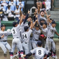 Sendai Ikuei celebrates after defeating Shimonoseki Kokusai in the Summer Koshien final in Nishinomiya, Hyogo Prefecture on Monday. | KYODO