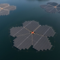 Floating solar panels manufactured by Hanwha Solutions on the Hapcheon Dam in Hapcheon, South Korea, on Feb. 8. More than 92,000 solar panels floating on the surface of a reservoir are able to generate 41 megawatts, enough to power 20,000 homes. | BLOOMBERG
