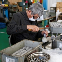 A worker assembles an air drill at Katsui Kogyo\'s factory in Higashiosaka, Osaka Prefecture, on June 23. | REUTERS