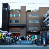People attend a drink, chat and music live event hosted by a factory in Higashiosaka on June 24. | REUTERS