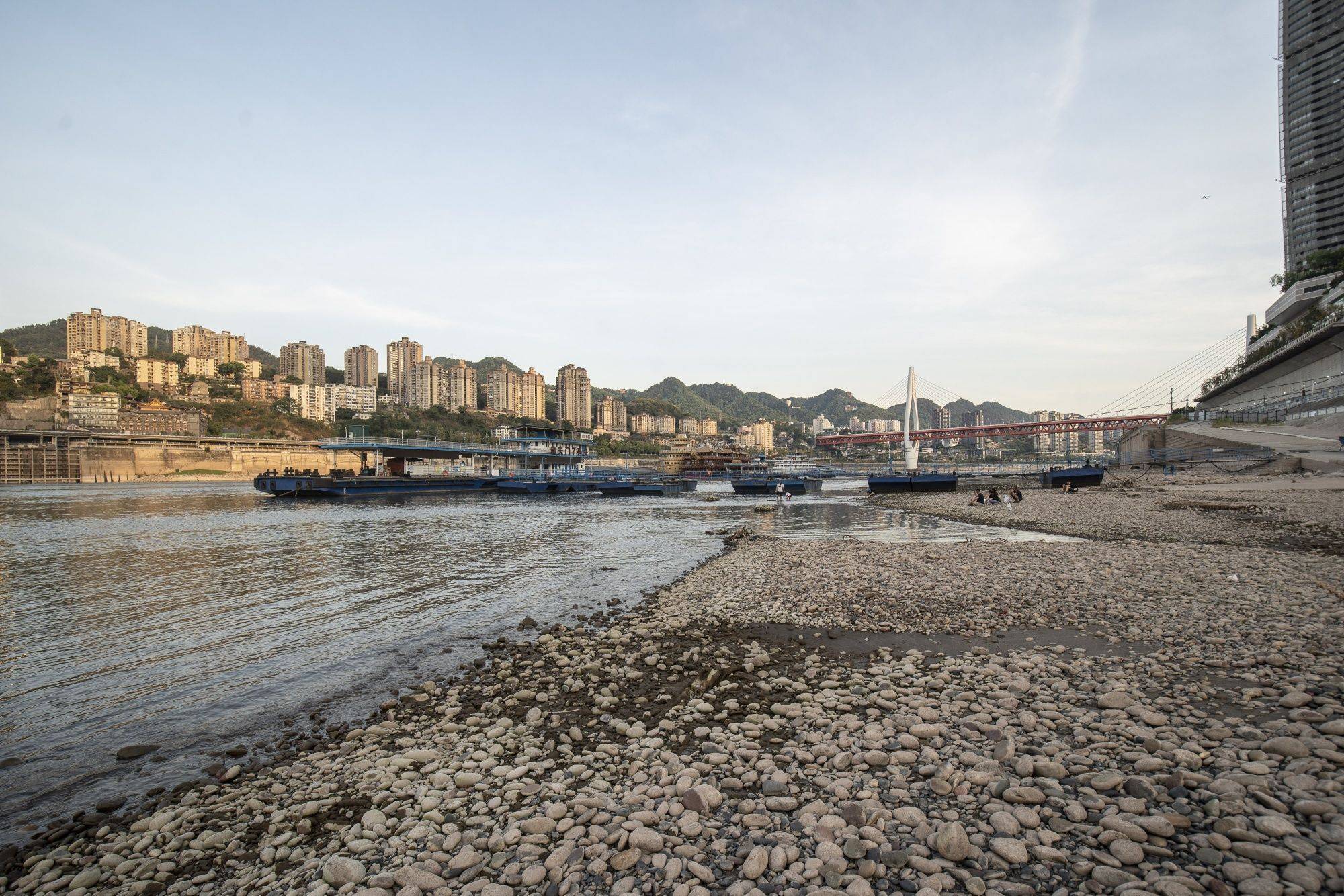 The shallow banks of the Yangtze River, due to low water levels caused by drought, near the confluence with the Jialing River in Chongqing on Friday. | BLOOMBERG