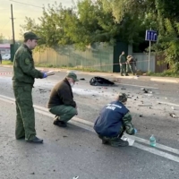 Investigators work at the site of a suspected car bomb attack that killed the daughter of Alexander Dugin, an ultranationalist Russian ideologue known as \"Putin\'s brain,\" near Moscow on Sunday. The Russian authorities are blaming the attack on Ukraine, a charge Kyiv denies.   | INVESTIGATIVE COMMITTEE OF RUSSIA / VIA REUTERS