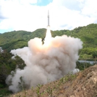 The Chinese military conducts a ballistic missile launch into the waters off the eastern coast of Taiwan from an undisclosed location in this image released on Aug. 4.  | EASTERN THEATER COMMAND / VIA REUTERS