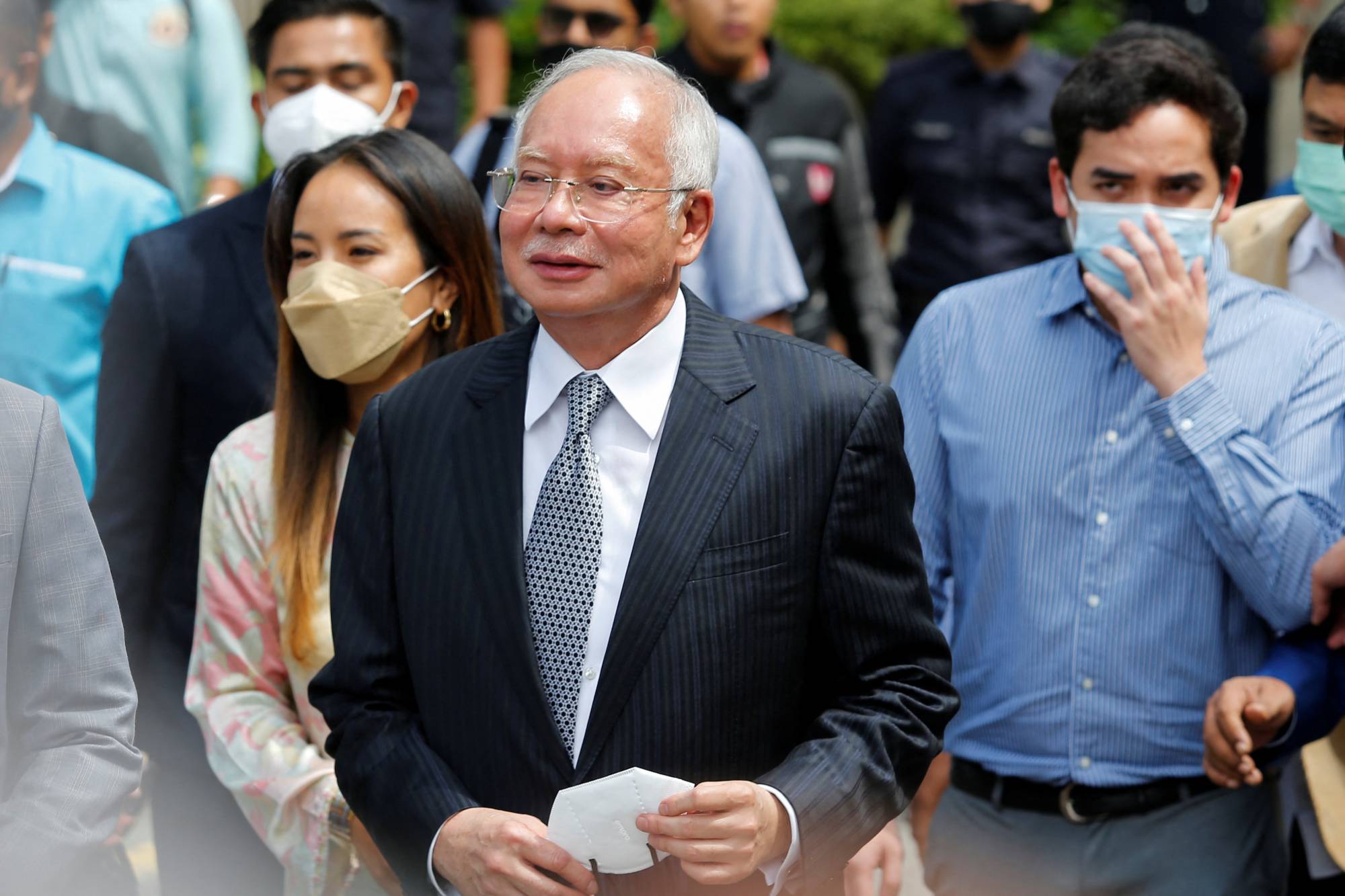 Former Malaysian Prime Minister Najib Razak walks out of the Federal Court during a court break, in Putrajaya, Malaysia, on Tuesday. | REUTERS