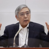 Bank of Japan Gov. Haruhiko Kuroda speaks during a news conference in Tokyo on July 21. | POOL / VIA BLOOMBERG