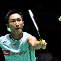 Kento Momota hits a return against H.S. Prannoy during the Badminton World Championships Tokyo Metropolitan Gymnasium on Wednesday. | AFP-JIJI