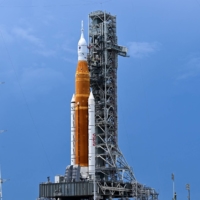 The Artemis I unmanned lunar rocket sits on the launchpad at the Kennedy Space Center in Cape Canaveral, Florida, on Friday ahead of its expected launch Monday.  | AFP-JIJI