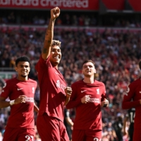 Liverpool striker Roberto Firmino (second from left) celebrates after scoring the team\'s fourth goal against Bournemouth in their Premier League match at Anfield on Saturday. | AFP-JIJI